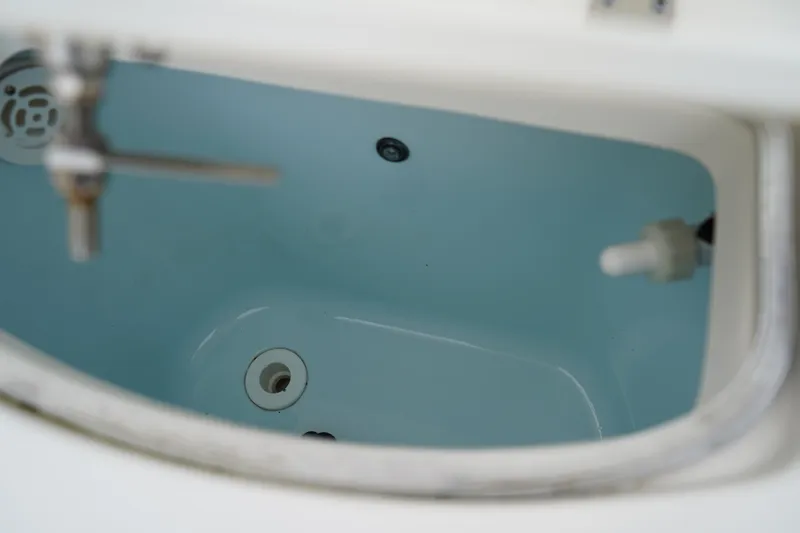 Slide: The Image of Livewell interior of 2023 Robalo R222 Center Console boat. - 9