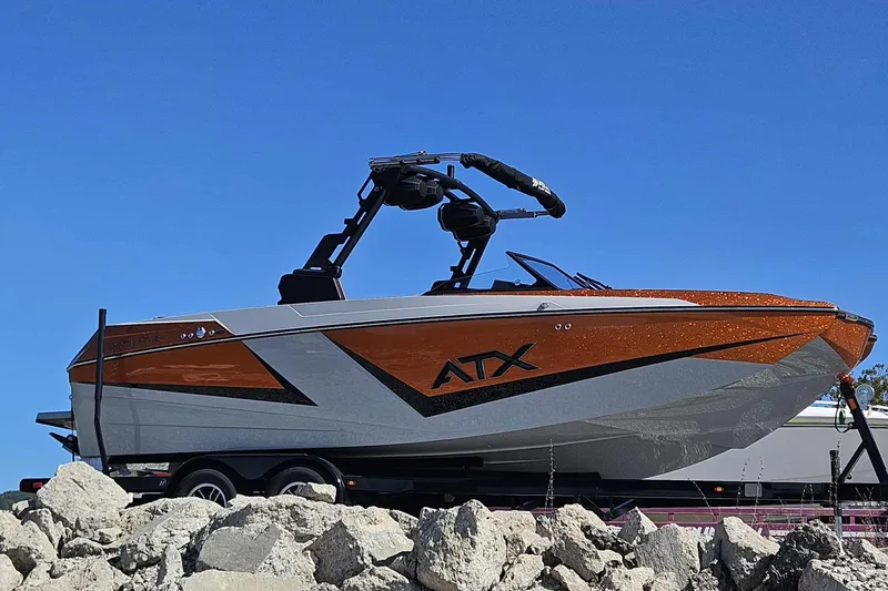 Slide: The Image of 2026 ATX Surf Boats 22 Type-S, sleek design, vibrant orange and gray, on trailer. - 15