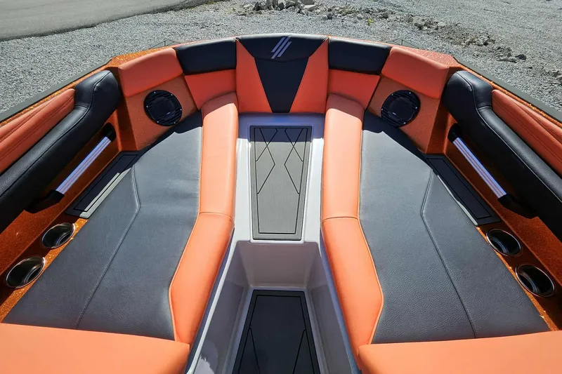 Slide: The Image of 2026 ATX Surf Boats 22 Type-S interior with orange and black seating, cup holders, and speakers. - 5