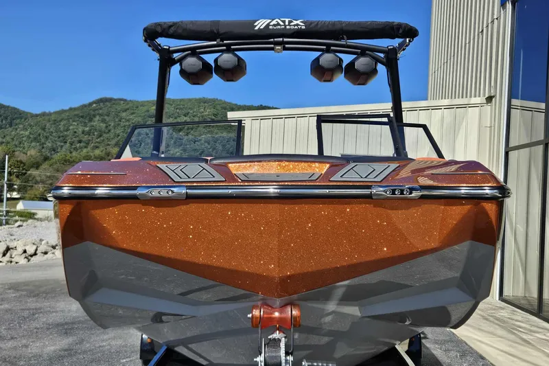 Slide: The Image of 2026 ATX Surf Boats 22 Type-S with metallic finish, parked outdoors. - 7
