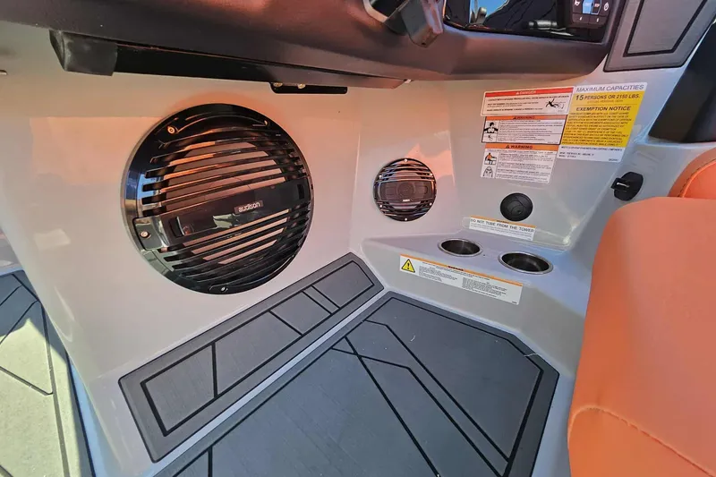 Slide: The Image of 2026 ATX Surf Boats 22 Type-S interior with speaker and safety labels. - 8