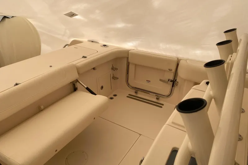 Slide: The Image of 2026 Grady-White Canyon 306 boat interior with seating and rod holders. - 15