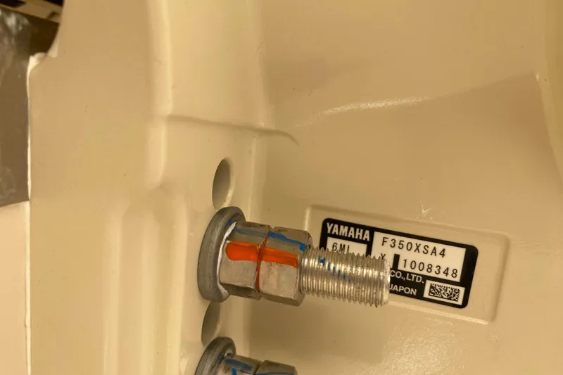 Slide: The Image of Close-up of Yamaha F350XSA4 engine part on 2026 Grady-White Canyon 306 boat. - 20