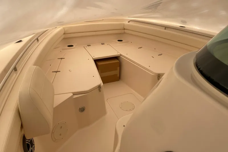 Slide: The Image of 2026 Grady-White Canyon 306 boat interior with spacious seating and storage compartments. - 3