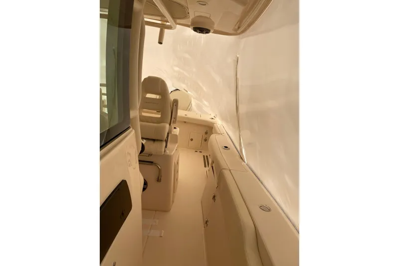 Slide: The Image of 2026 Grady-White Canyon 306 boat interior with seating and storage compartments. - 6