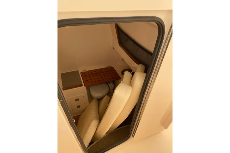 Slide: The Image of Interior cabin of 2026 Grady-White Canyon 306 boat, featuring seating and storage. - 8