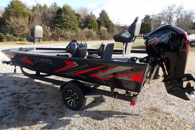 Slide: The Image of 2026 Lund 1875 Renegade boat with Mercury Pro XS engine on a trailer. - 11