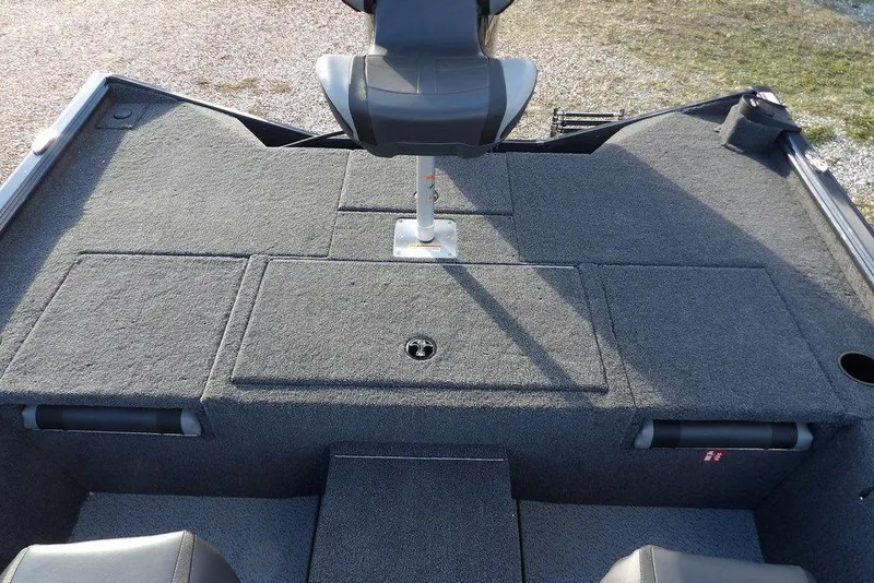 Slide: The Image of 2026 Lund 1875 Renegade boat interior with gray carpet and seating. - 16