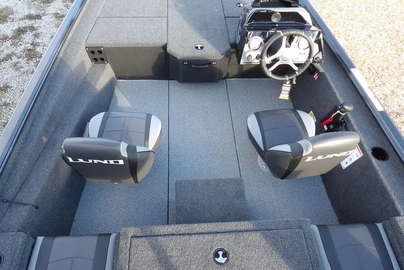 Slide: The Image of 2026 Lund 1875 Renegade boat interior with two seats and steering console. - 17