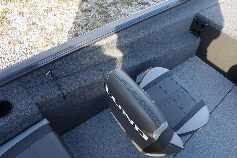 Slide: The Image of 2026 Lund 1875 Renegade boat interior with seating and carpeted flooring. - 20