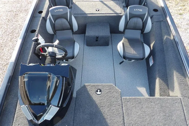 Slide: The Image of 2026 Lund 1875 Renegade boat interior with dual seats and steering console. - 25