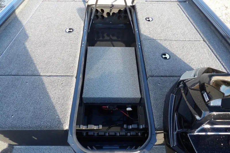 Slide: The Image of 2026 Lund 1875 Renegade boat interior with storage compartments and motor. - 27