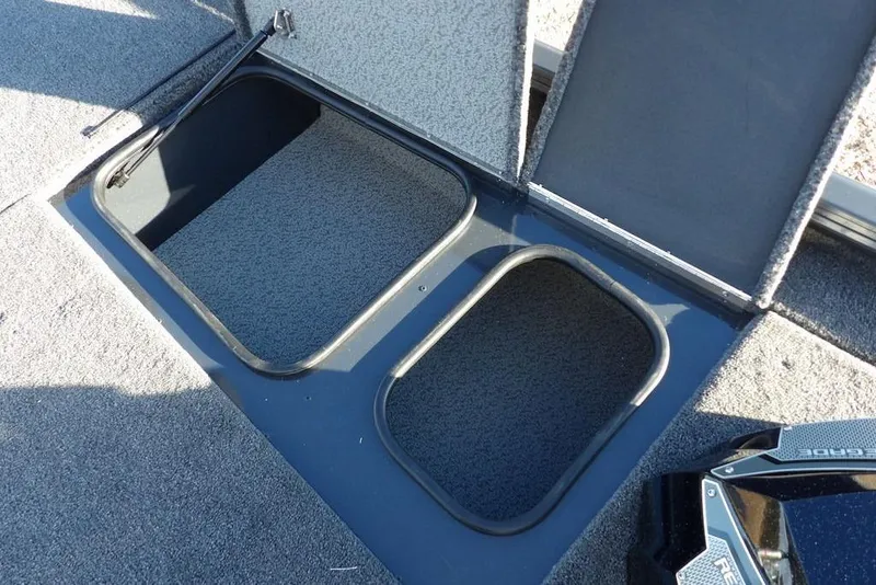Slide: The Image of Open storage compartments on 2026 Lund 1875 Renegade boat deck. - 28
