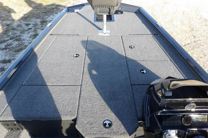 Slide: The Image of 2026 Lund 1875 Renegade boat deck with storage compartments and seating. - 29