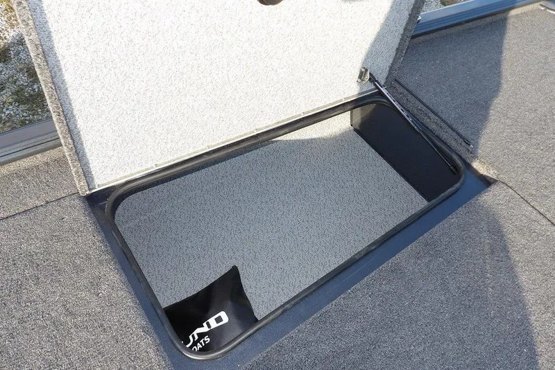 Slide: The Image of Open storage compartment on 2026 Lund 1875 Renegade boat deck. - 31