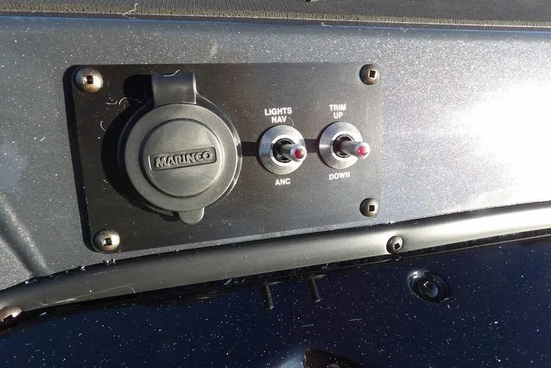 Slide: The Image of Control panel of 2026 Lund 1875 Renegade boat with switches and socket. - 36