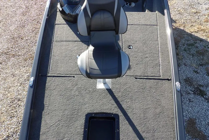 Slide: The Image of 2026 Lund 1875 Renegade boat interior with gray carpet and central seat. - 38