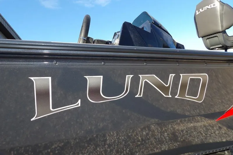 Slide: The Image of 2026 Lund 1875 Renegade boat with logo, close-up view. - 41