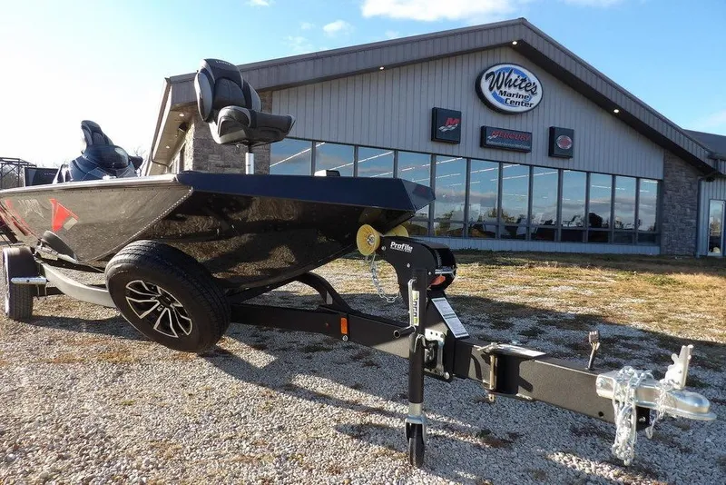 Slide: The Image of 2026 Lund 1875 Renegade boat on trailer outside White's Marine Center. - 44