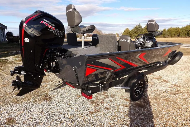 Slide: The Image of 2026 Lund 1875 Renegade boat with Mercury Pro XS engine on a trailer. - 7