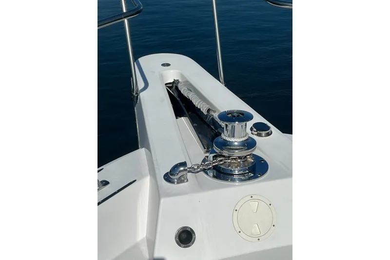 Slide: The Image of Bow of 1985 Hatteras 58 Motor Yacht with anchor winch and railing. - 10