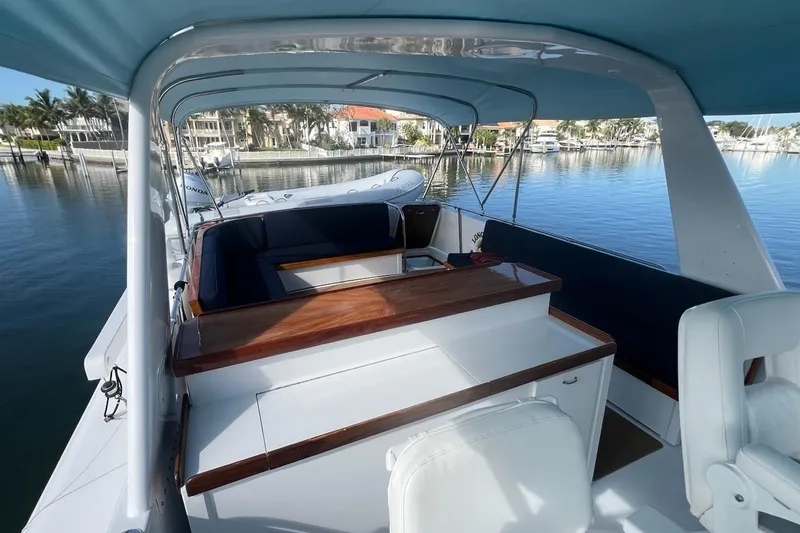 Slide: The Image of 1985 Hatteras 58 Motor Yacht interior with seating and water view. - 15