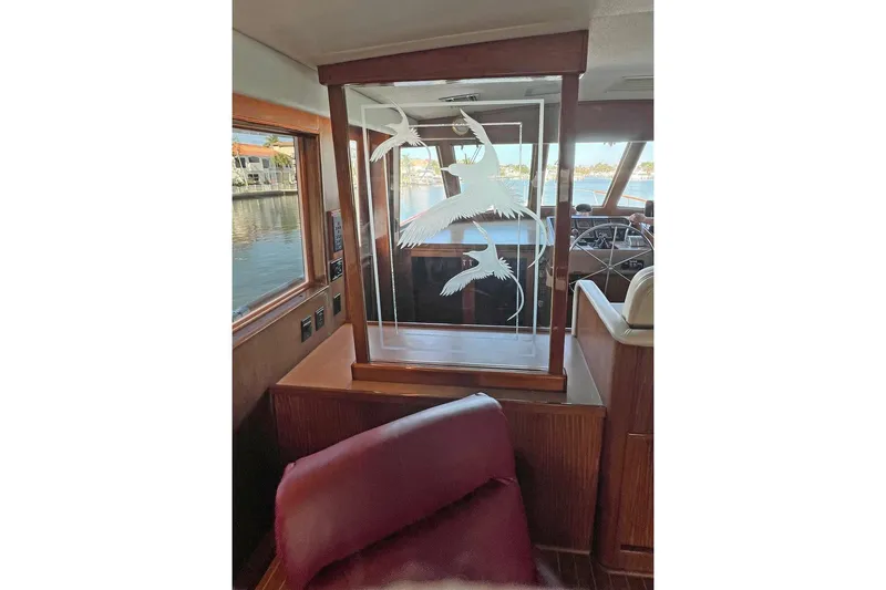 Slide: The Image of Interior of 1985 Hatteras 58 Motor Yacht with etched glass panel and wood accents. - 20