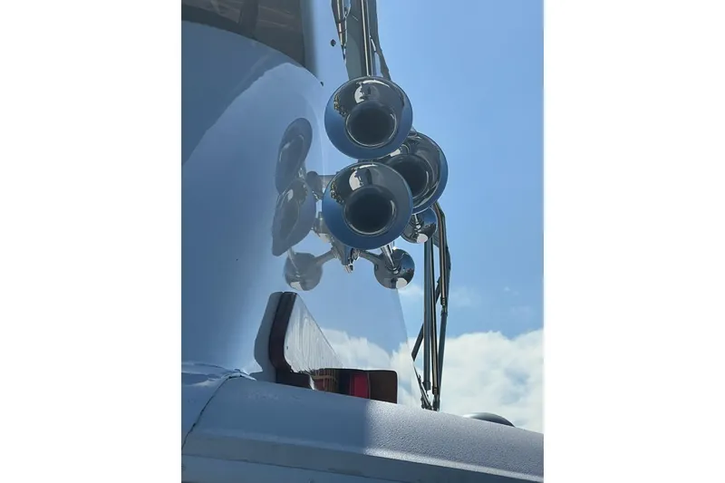 Slide: The Image of Close-up of chrome horns on a 1985 Hatteras 58 Motor Yacht against blue sky. - 35