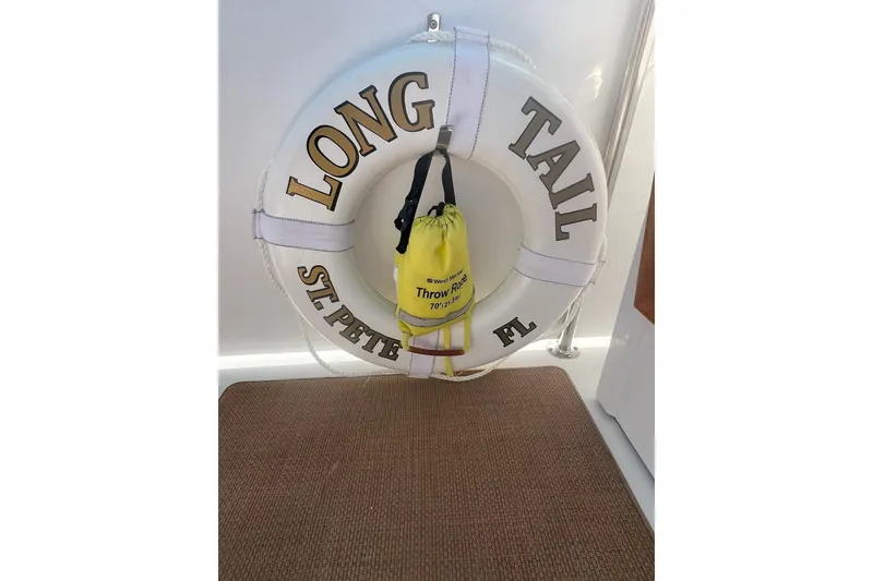 Slide: The Image of Life ring on 1985 Hatteras 58 Motor Yacht, labeled "Long Tail, St. Pete, FL." - 47