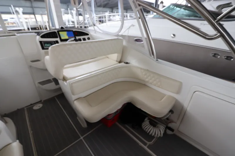 Slide: The Image of Interior of 2014 Intermarine 380 Sport boat with white seating and control panel. - 14