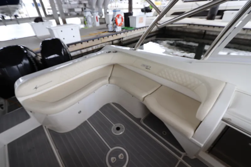 Slide: The Image of 2014 Intermarine 380 Sport boat interior with beige seating and sleek design. - 15