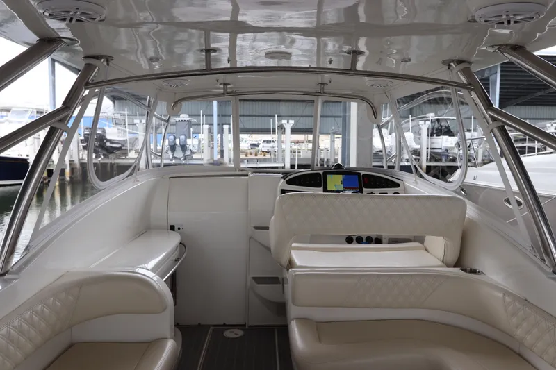 Slide: The Image of Interior of a 2014 Intermarine 380 Sport yacht with luxurious seating and navigation controls. - 17