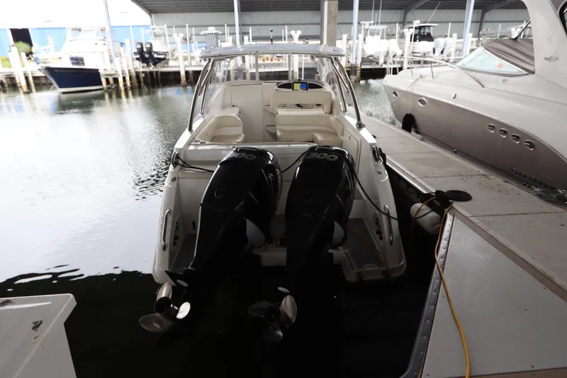 Slide: The Image of 2014 Intermarine 380 Sport boat docked with dual outboard engines. - 2