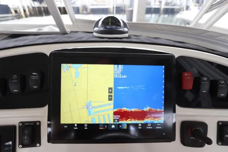 Slide: The Image of Control panel of a 2014 Intermarine 380 Sport boat with navigation display. - 21