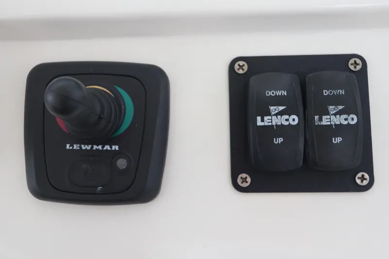 Slide: The Image of Control panel with Lewmar joystick and Lenco trim tab switches on 2014 Intermarine 380 Sport. - 23