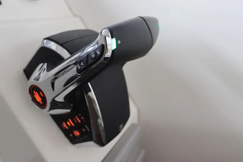 Slide: The Image of Throttle control of 2014 Intermarine 380 Sport boat, featuring sleek design and illuminated indicators. - 24