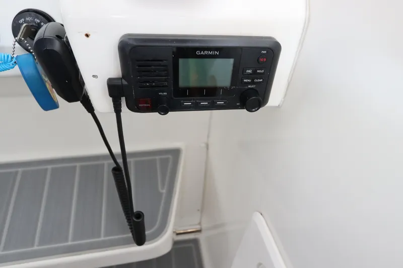 Slide: The Image of Garmin marine radio on 2014 Intermarine 380 Sport boat dashboard. - 25