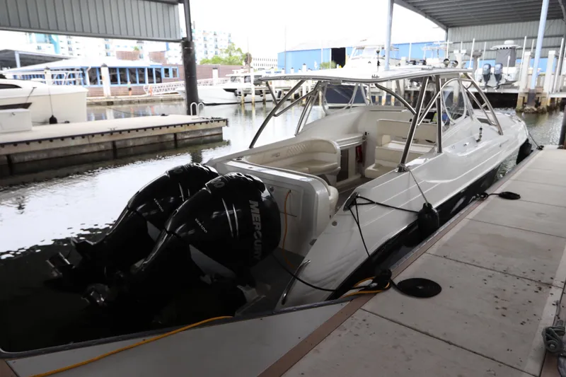 Slide: The Image of 2014 Intermarine 380 Sport boat docked with dual Mercury engines. - 3