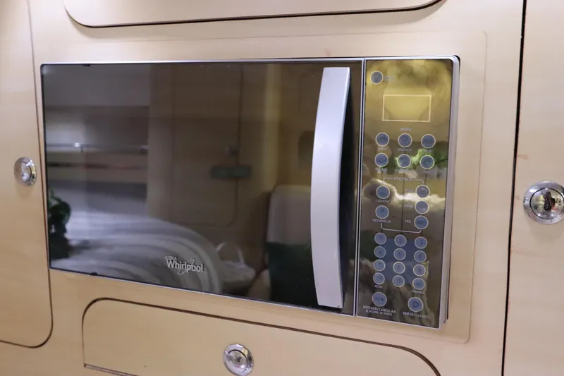 Slide: The Image of Built-in Whirlpool microwave in 2014 Intermarine 380 Sport yacht interior. - 30