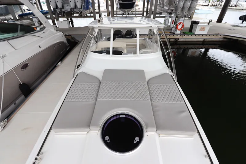 Slide: The Image of 2014 Intermarine 380 Sport yacht with cushioned deck, docked in marina. - 6