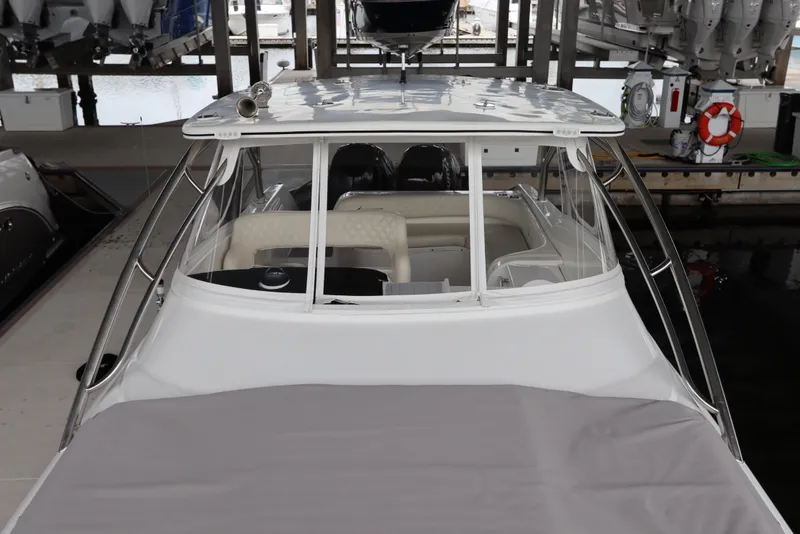 Slide: The Image of 2014 Intermarine 380 Sport yacht docked in a marina, showcasing sleek design and spacious interior. - 7