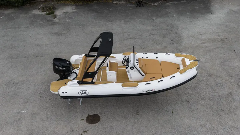 The Image of Aerial view of 2025 Aqvaboats Luxrib 19 inflatable boat with Suzuki outboard motor. - 0