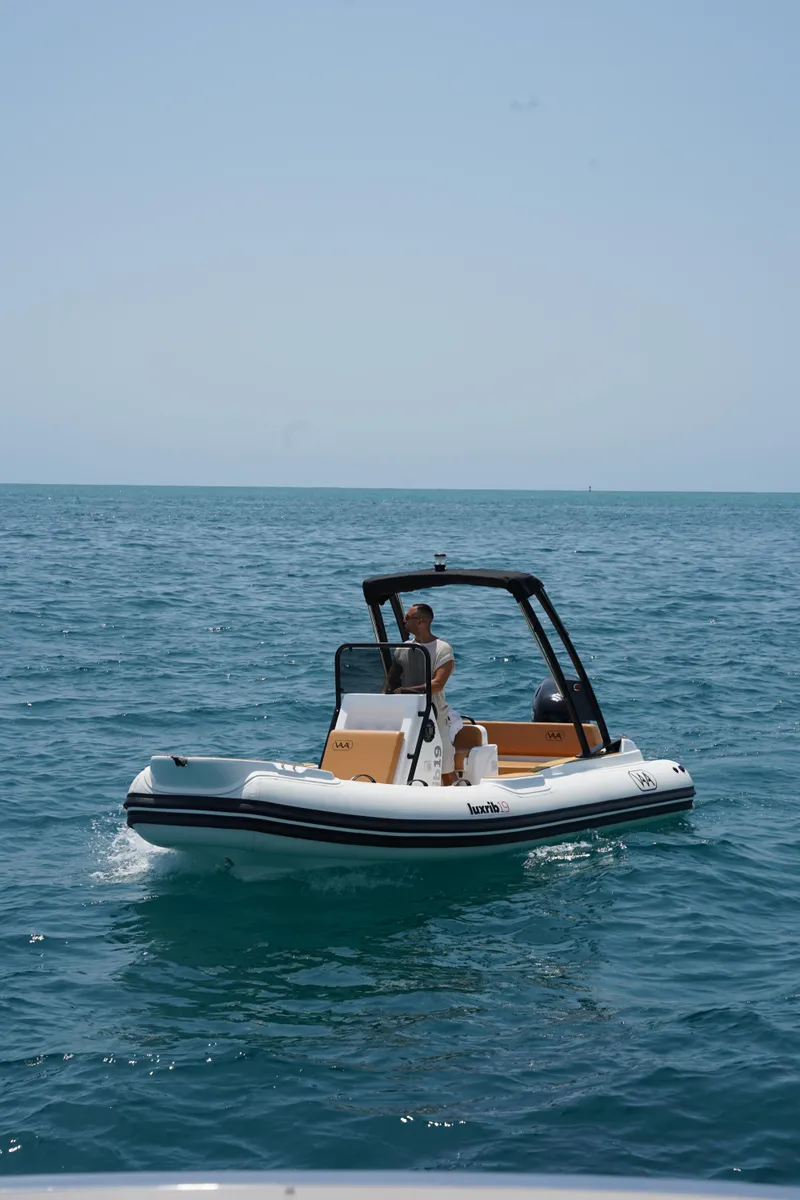 Slide: The Image of 2025 Aqvaboats Luxrib 19 on open water. - 2