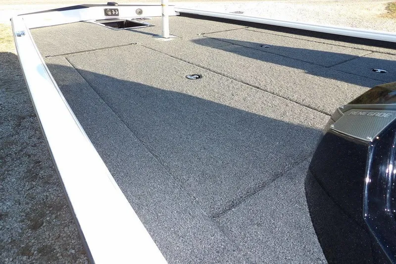 Slide: The Image of 2026 Lund 1975 Renegade boat deck with carpeted surface and storage compartments. - 12