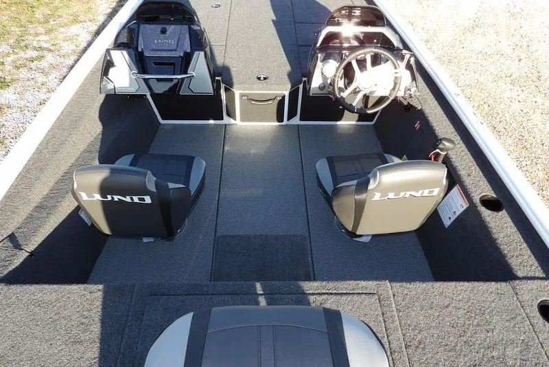 Slide: The Image of 2026 Lund 1975 Renegade boat interior with dual seats and steering console. - 15