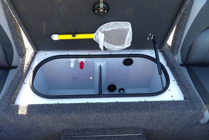 Slide: The Image of Livewell compartment in 2026 Lund 1975 Renegade boat, featuring net and aeration system. - 16