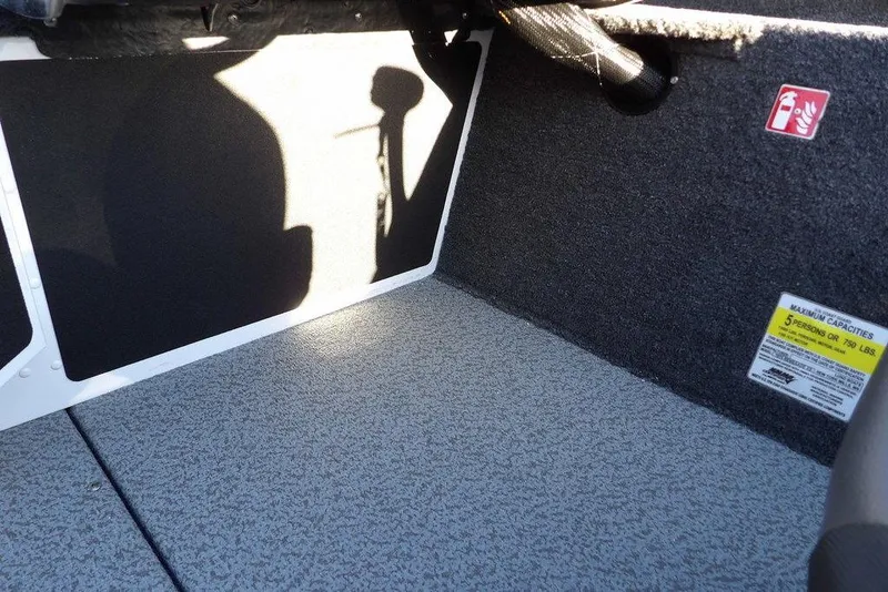 Slide: The Image of Interior of 2026 Lund 1975 Renegade boat, showing capacity label and textured flooring. - 22