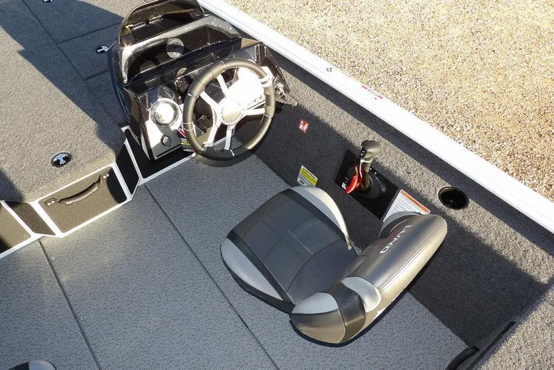Slide: The Image of Interior of 2026 Lund 1975 Renegade boat with steering wheel and seat. - 26