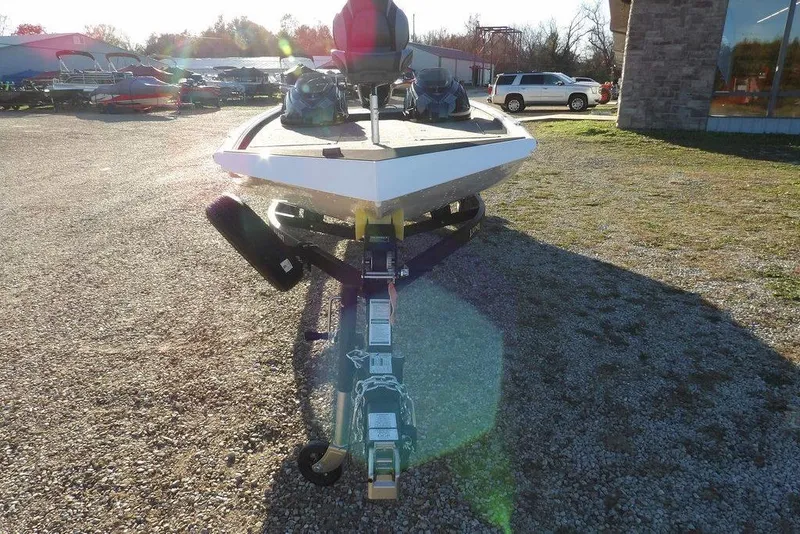 Slide: The Image of Front view of 2026 Lund 1975 Renegade boat on trailer in outdoor setting. - 3