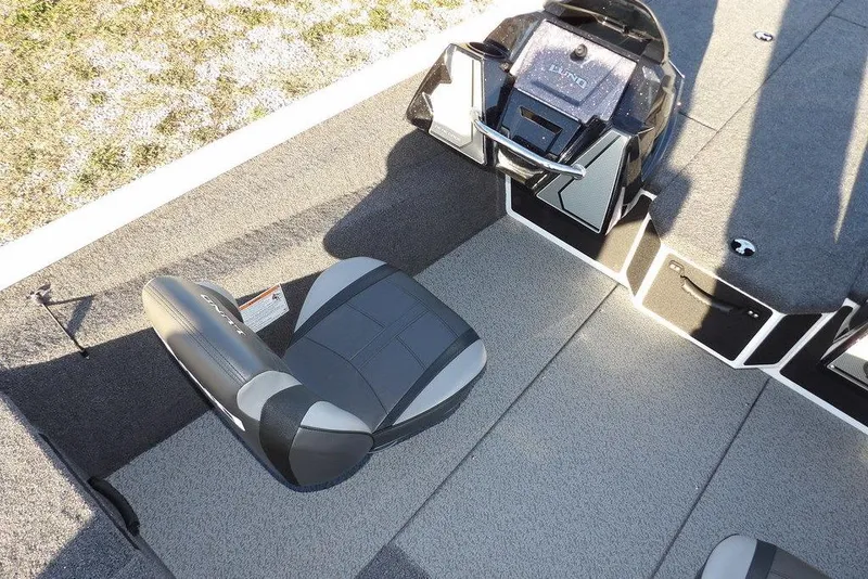 Slide: The Image of 2026 Lund 1975 Renegade boat interior with seating and control panel. - 31